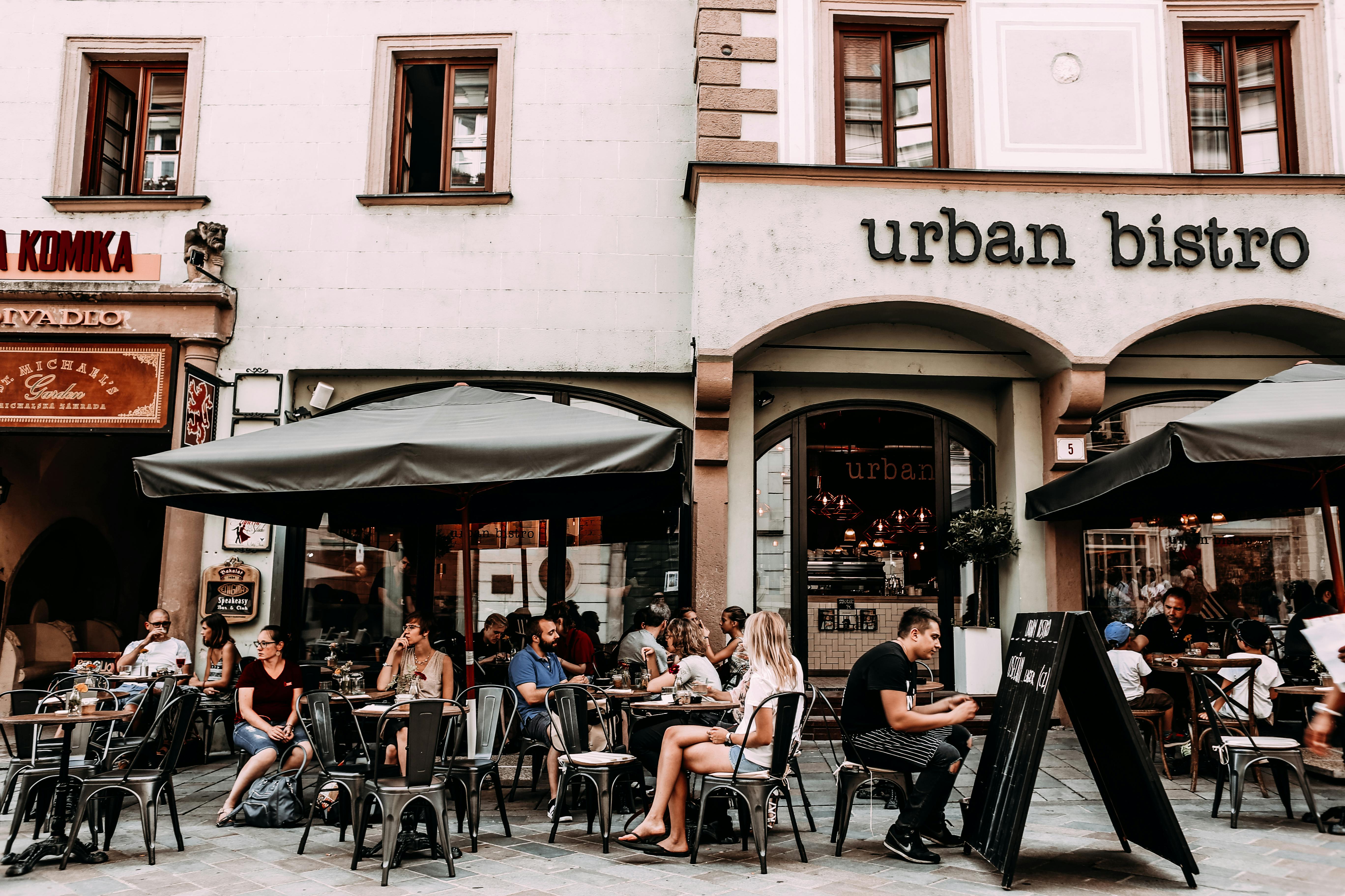 street cafe with people and tables