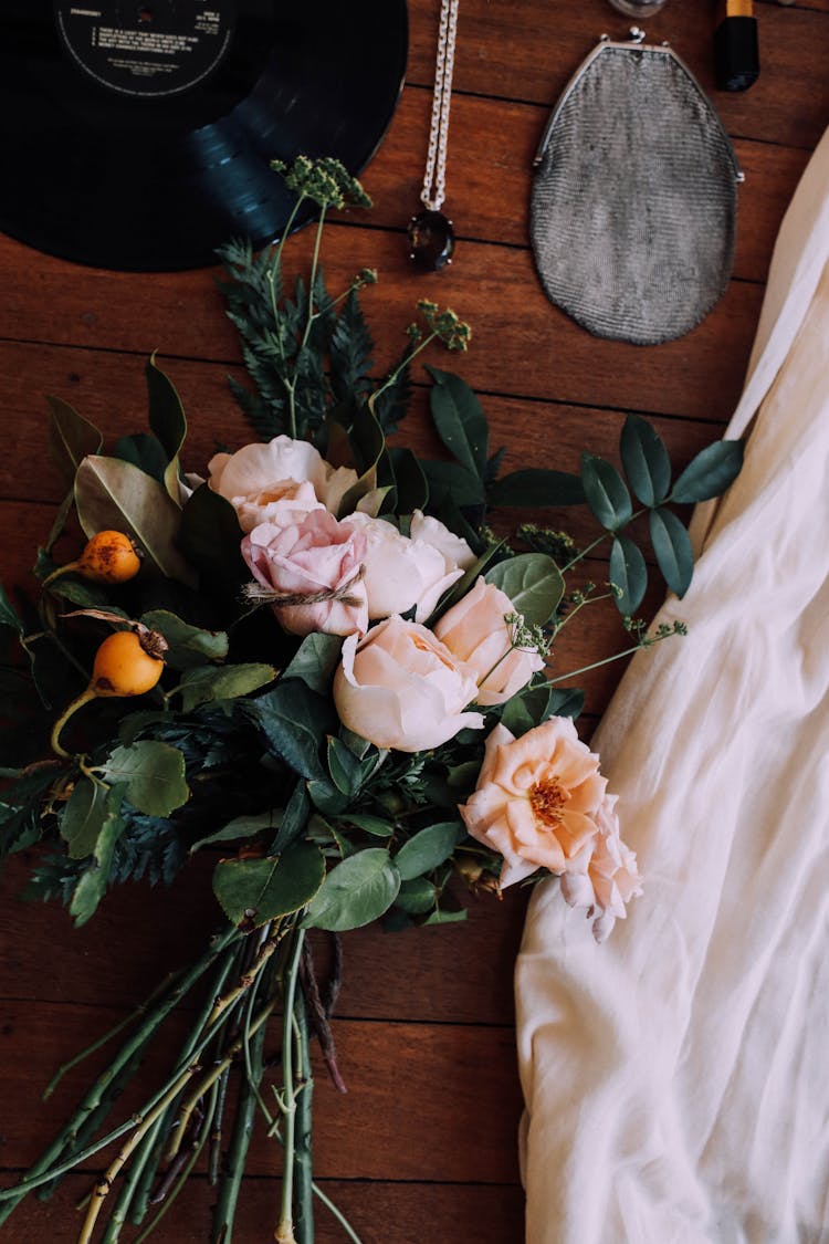 Composition With Rose Bouquet On Table