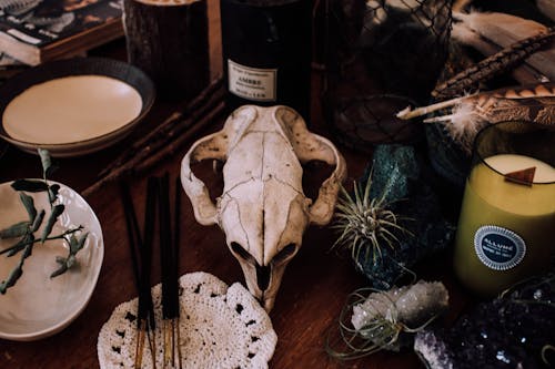 Table setting with candles and skull