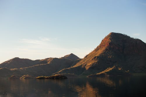 Rough rocky mountains near calm lake