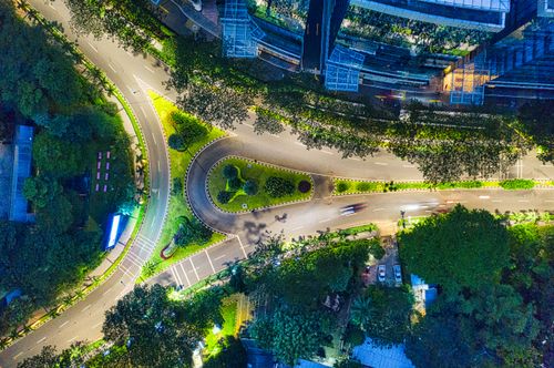 Free Stunning aerial view of illuminated city streets and buildings in Jakarta, Indonesia at night. Stock Photo