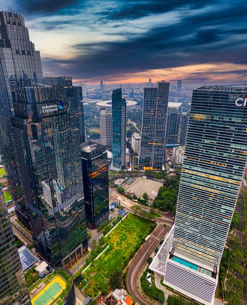 Free Stunning aerial shot of Jakarta's skyline at sunset, showcasing its vibrant cityscape. Stock Photo