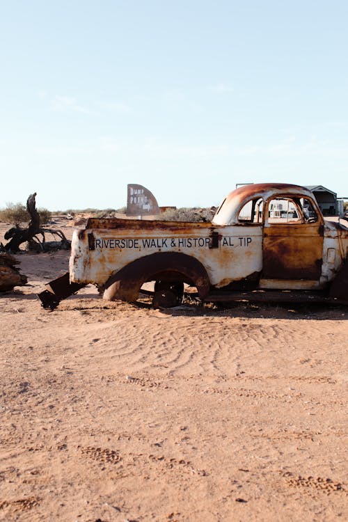 Old rusty car in desert land