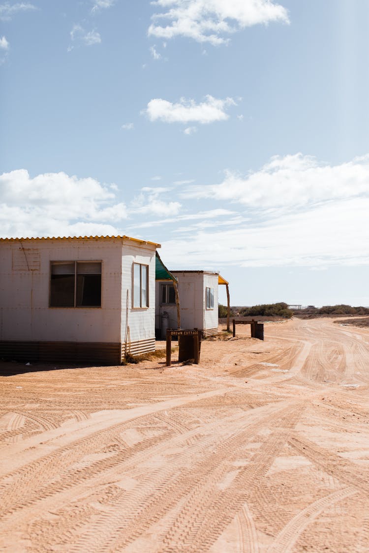 Residential Buildings In Poor Village Near Rural Road