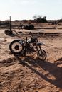 Motorbike placed on dry ground in rough terrain