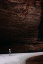 Anonymous woman exploring rocky canyon during trip in Australia