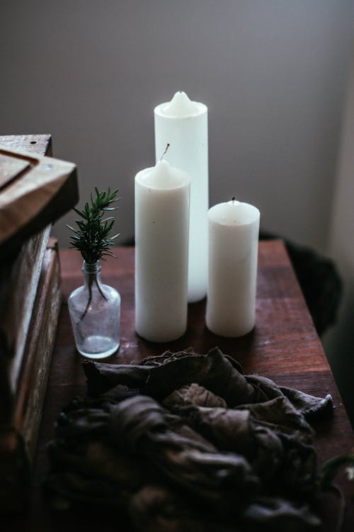 Candles placed on wooden table