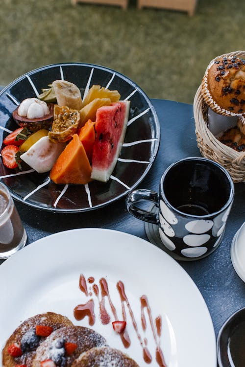 Delicious breakfast table with fruits and desserts