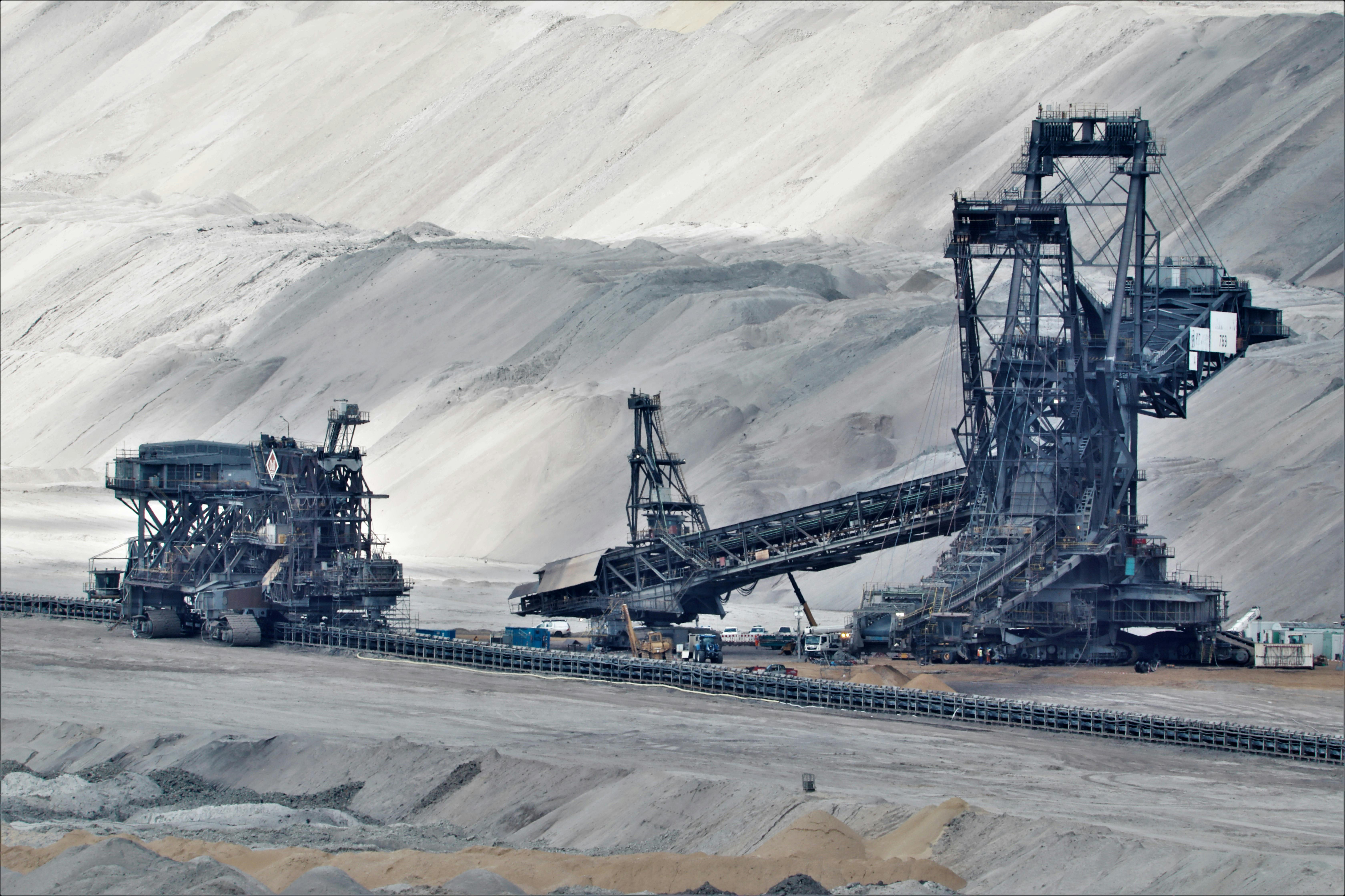 a bucket wheel excavator in a coal mine in grayscale photography