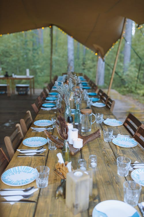 Free Outdoor Table Setting under a Tent Stock Photo