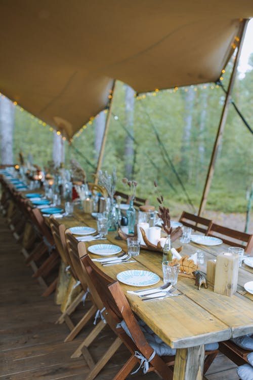Free Outdoor Table Setting under a Tent Stock Photo