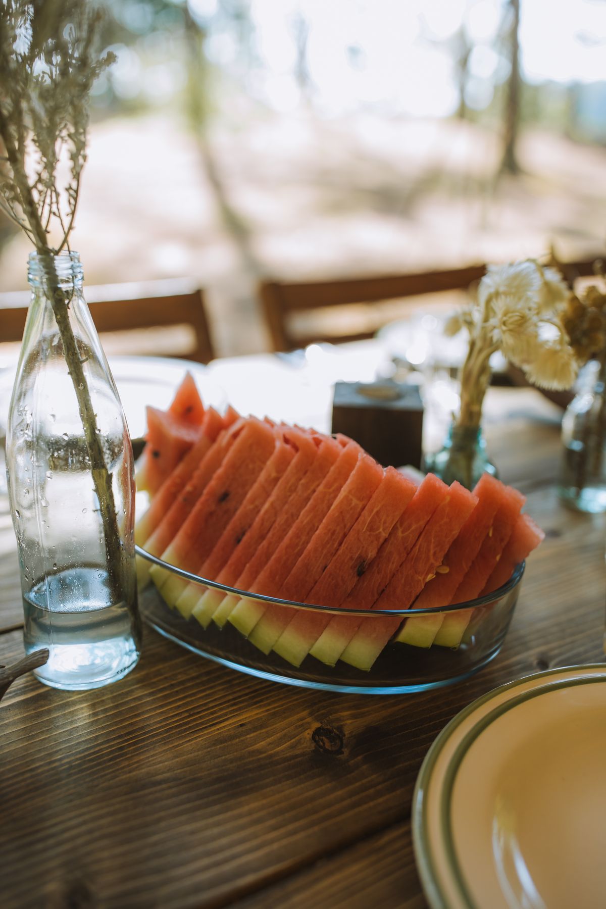 Fresh watermelon slice on a wooden table, an example of produce sold both retail and wholesale