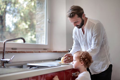 Father and Daughter in Kitchen Together