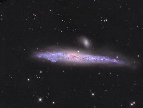 A breathtaking image of the NGC 4631 Whale Galaxy with colorful nebulas and stars in the universe.