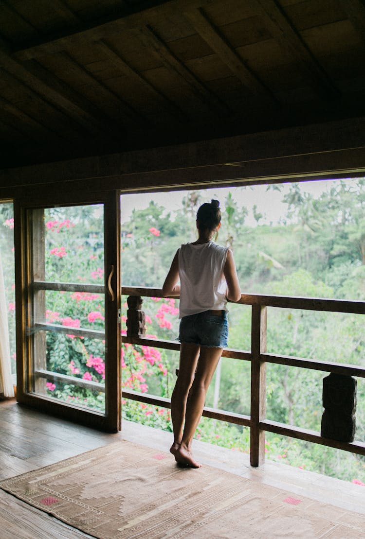 Slim Tourist On Balcony In Daytime