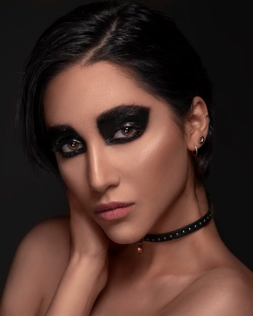 Woman With Black Eyeshadow Seriously Looking at the Camera