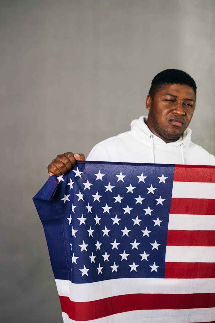 Man Holding An American Flag