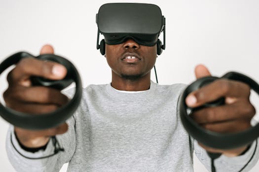Focused man using VR headset and controllers immersed in virtual reality.