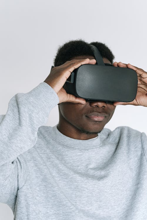 Free A Man Fixing the VR Headset he is Wearing Stock Photo