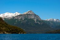 Majestic snow-capped mountains and serene lake scene in Argentina.