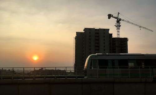 Foto profissional grátis de construção, lindo pôr do sol, metrô