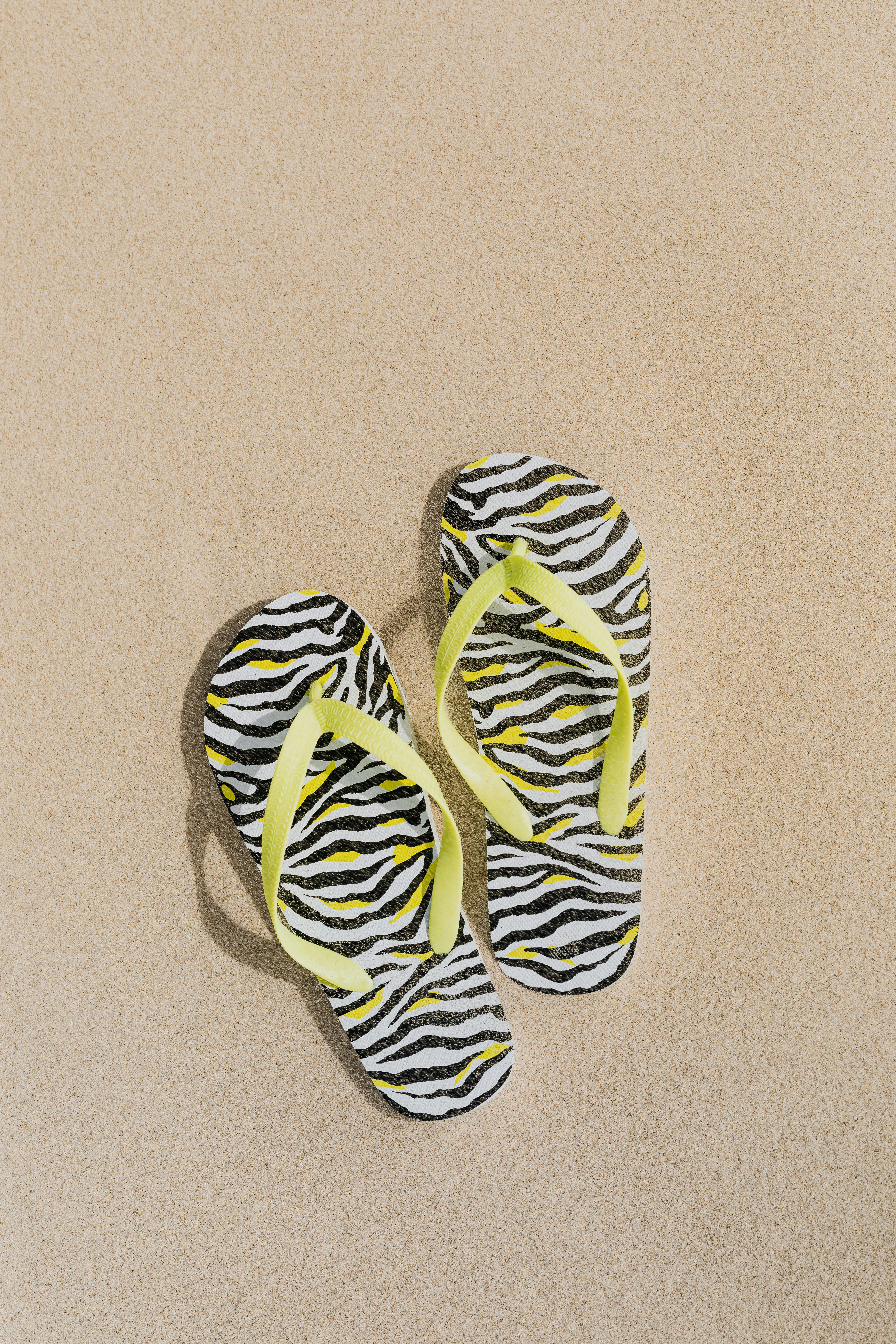 Flip Flops Slippers on a Mat · Free Stock Photo