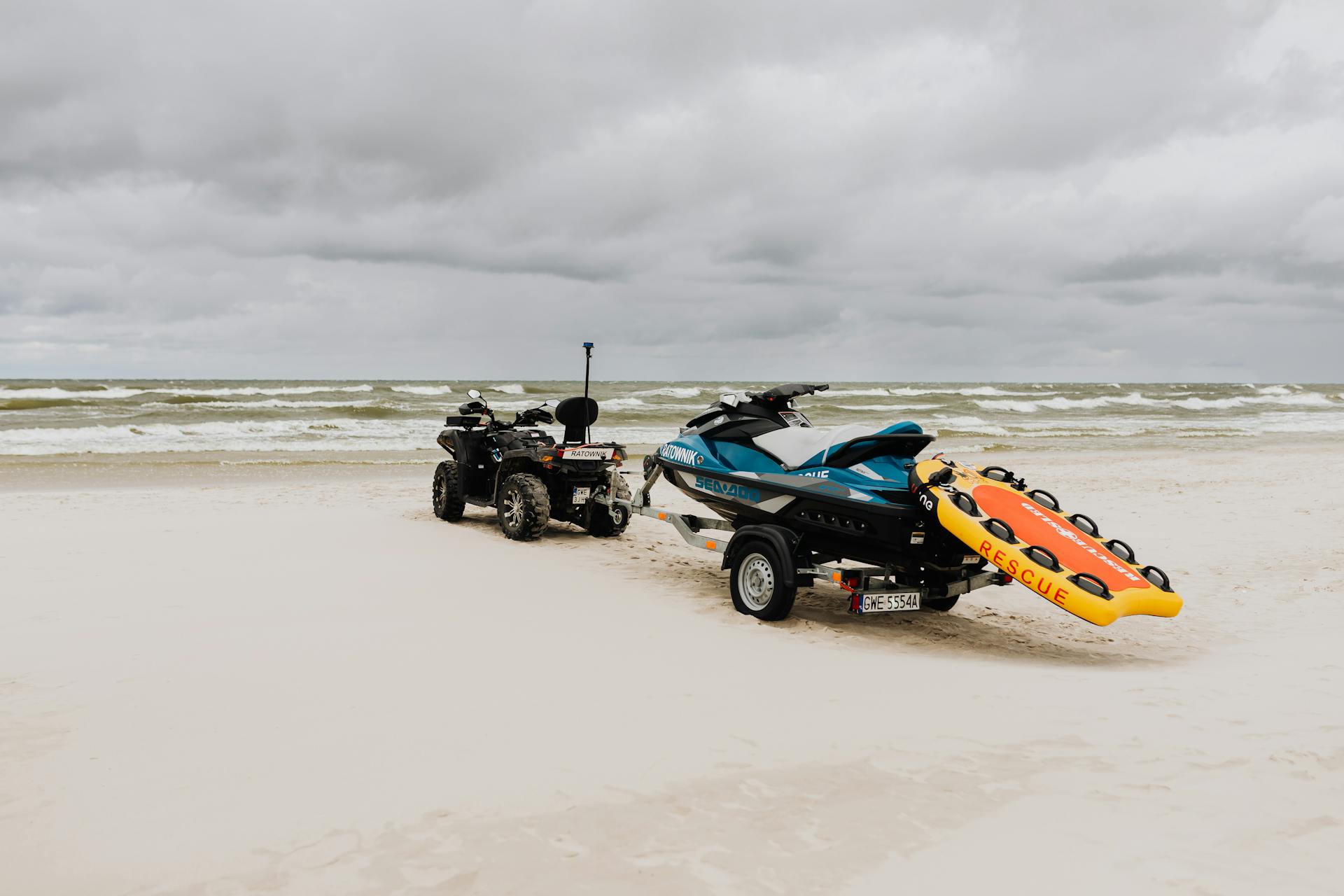 Jet Ski Being Pulled by a Quad Bike on the Beach