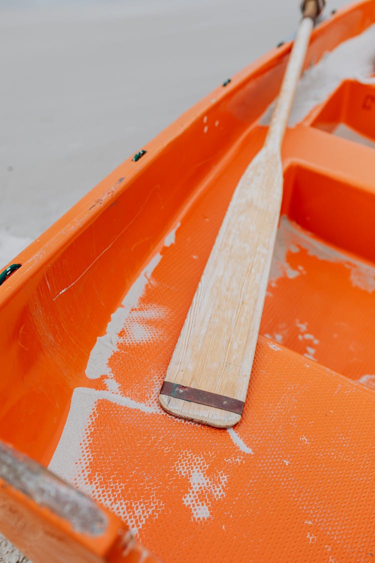 A Wooden Oar On Orange Boat