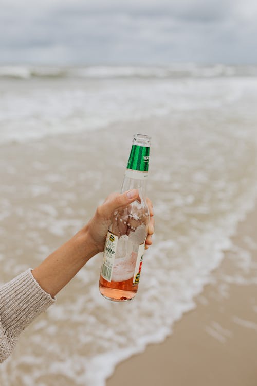 Person Holding a Beer