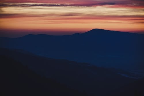 Free Mountains under colorful sky at sunset Stock Photo