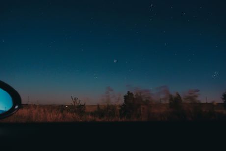 Night sky over open country by Diana on Pexels