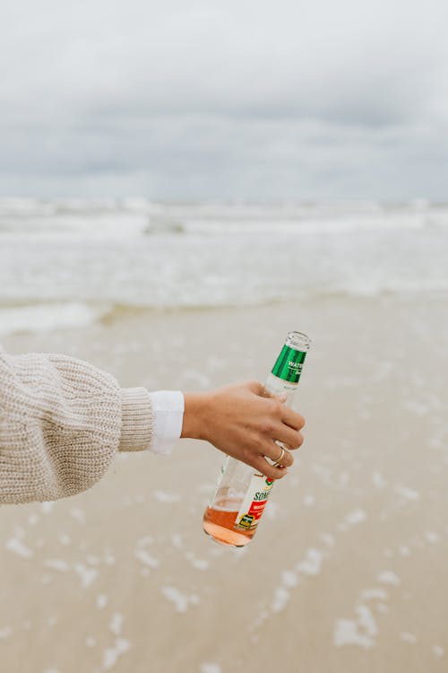 Person Holding a Beer