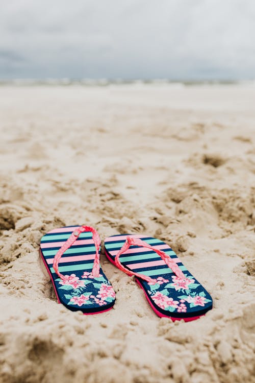 Free Flip Flops on Sand Stock Photo