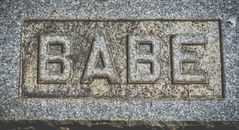 Inscription babe on gray stone block