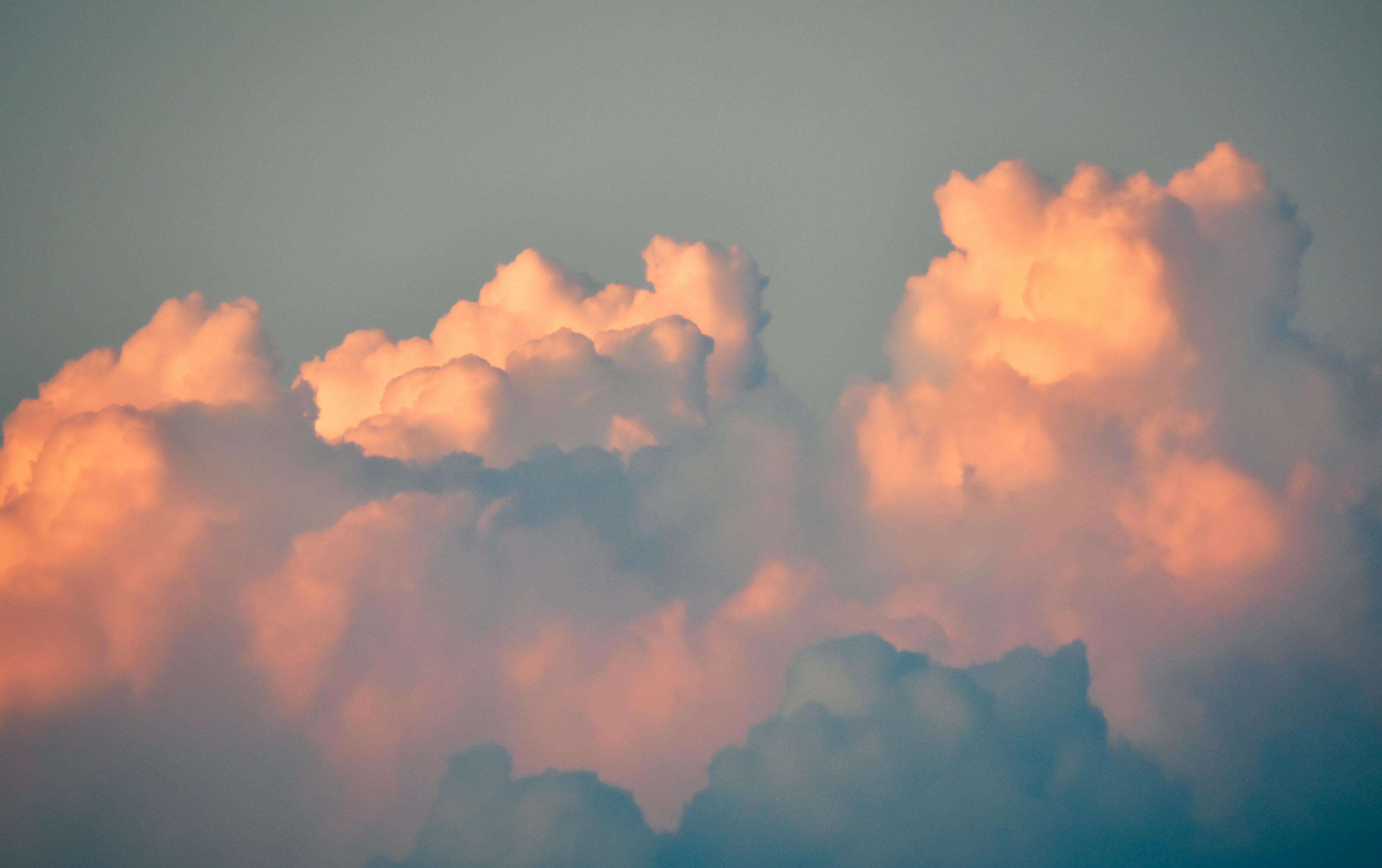 Fluffy Cumulus Clouds In Gray Sky On Sunrise · Free Stock Photo