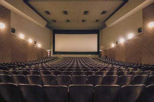 Free Red Chairs Inside a Theater Stock Photo