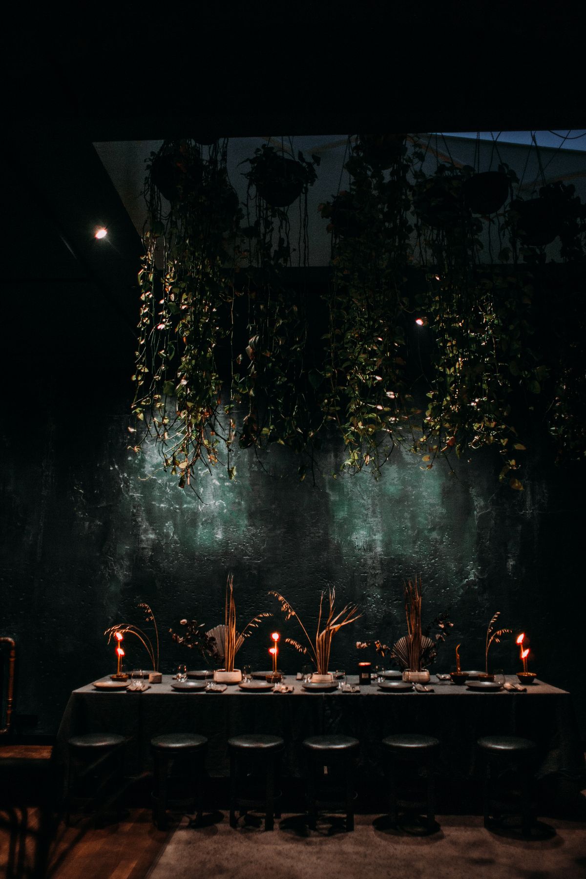 A dimly lit contemporary restaurant dining room