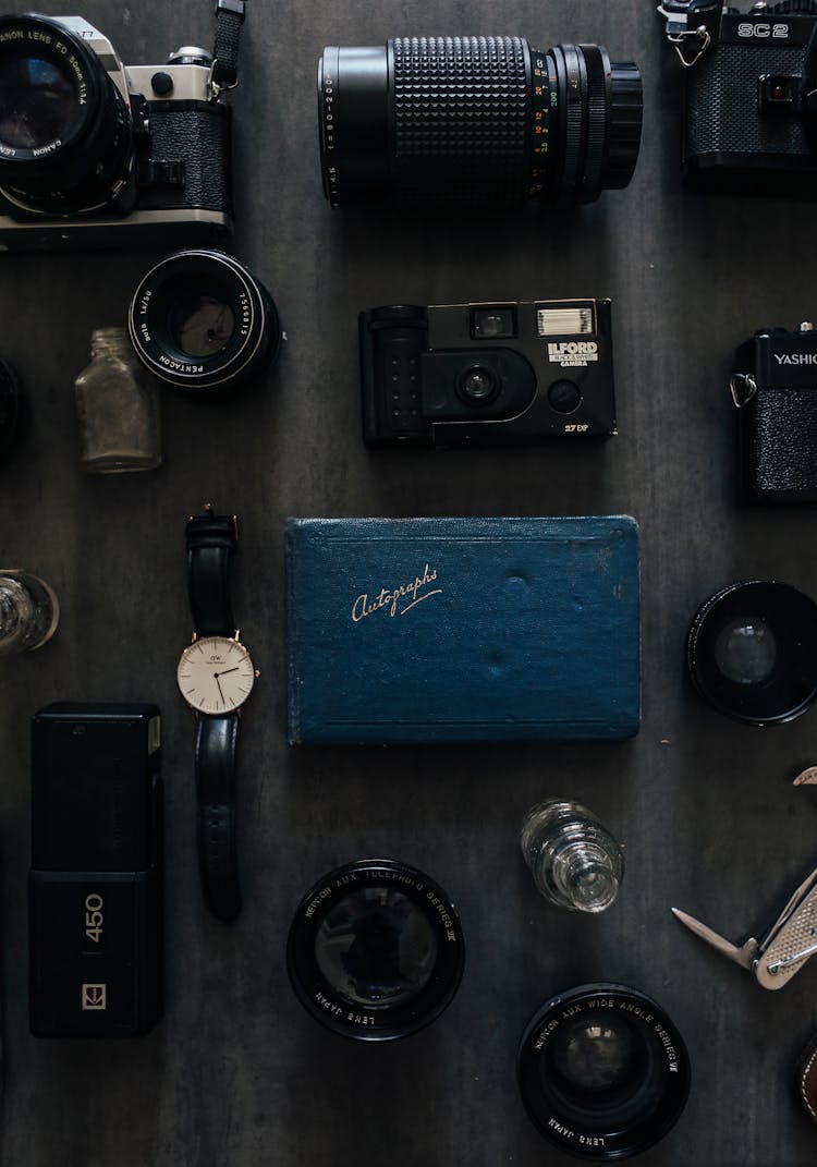 Diary Among Vintage Photo Cameras And Lens