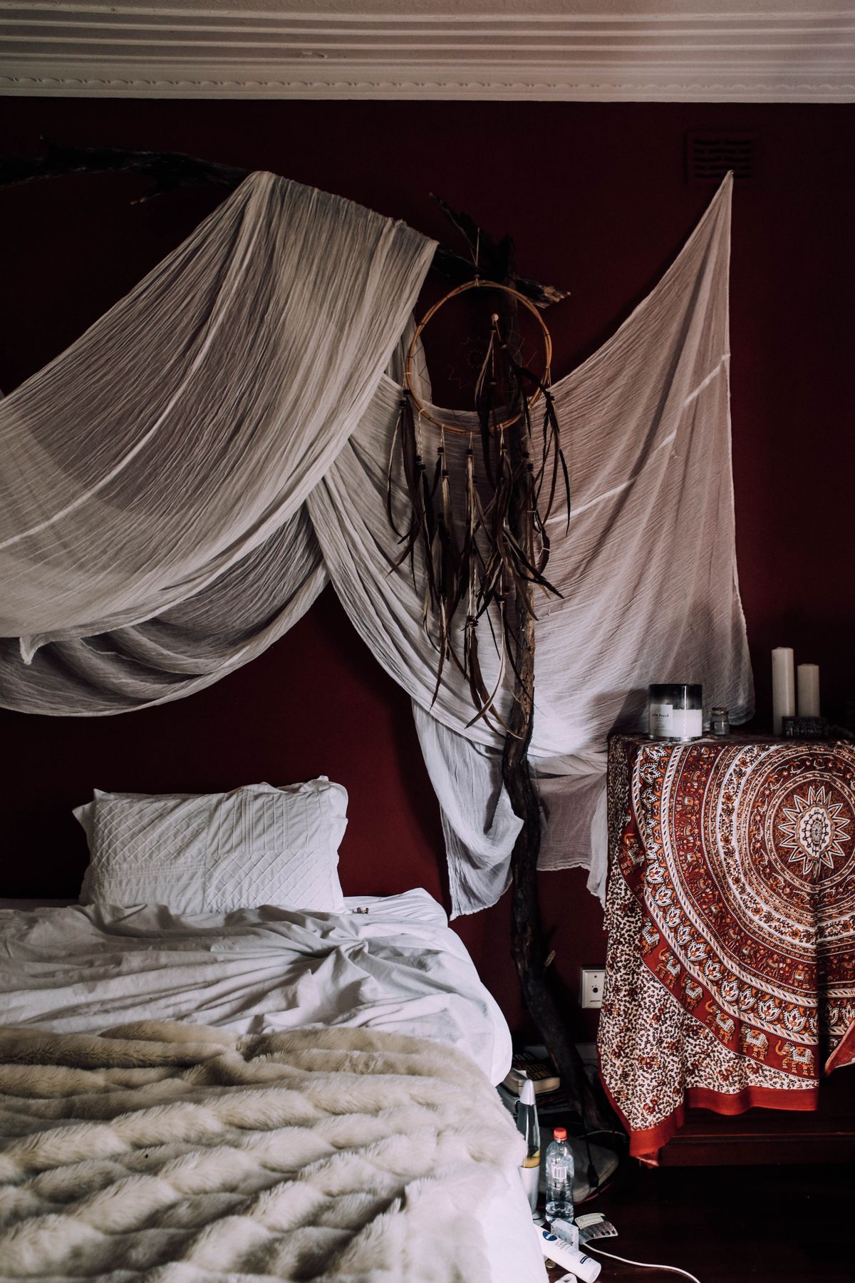 Boho bedroom inspo ideas with layered fabrics and a dreamcatcher
