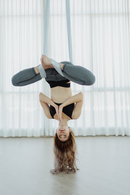 Free Woman Doing Aerial Yoga Stock Photo