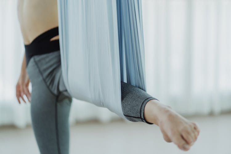 Woman Stretching Legs With Gymnastic Sash