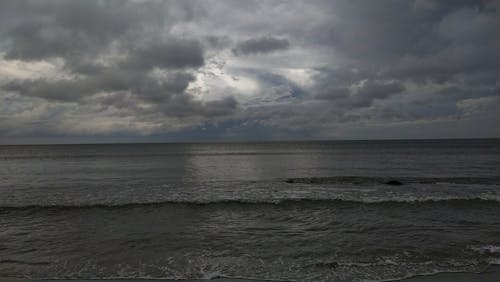 Darmowe zdjęcie z galerii z burza na plaży, ciemne chmury, plaża