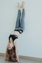 Woman in Black Sports Bra and Gray Leggings