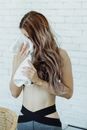 Woman in Black Panty Covering Her Body With White Towel