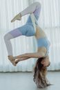 Woman in Blue Sports Bra and Blue Leggings Doing Yoga