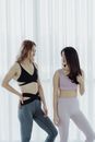 Woman in Black Sports Bra and Blue Denim Jeans