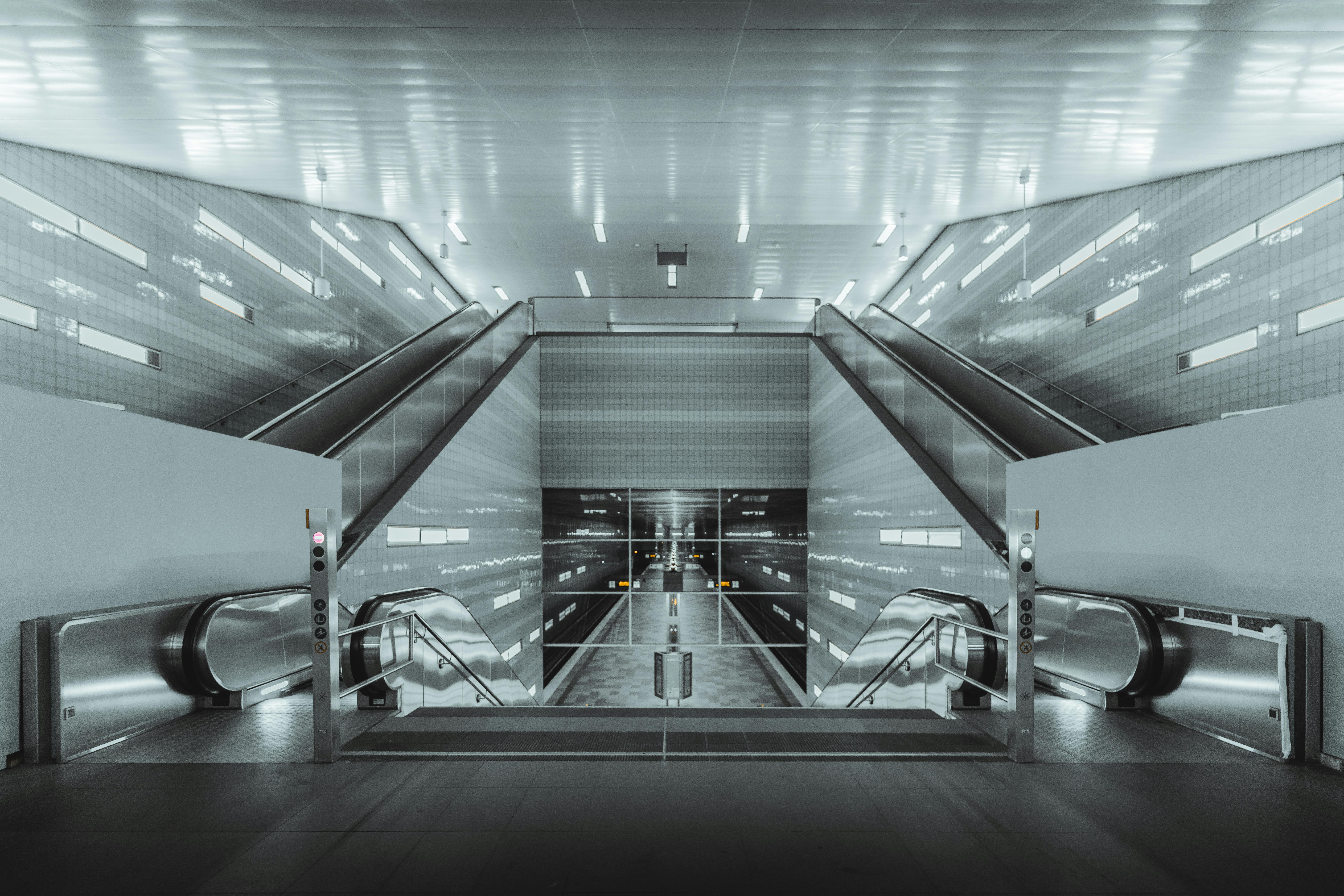 gray metal tunnel with white ceiling