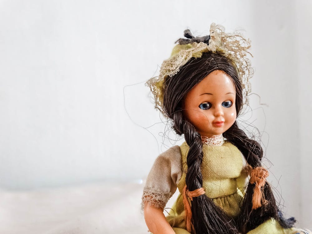 Free Close-Up Shot of a Girl Doll on White Background Stock Photo