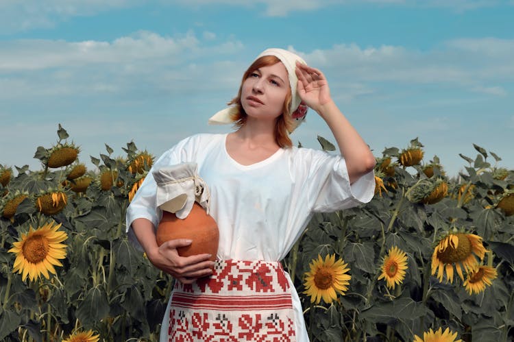 Peasant Woman With Clay Pot In Countryside