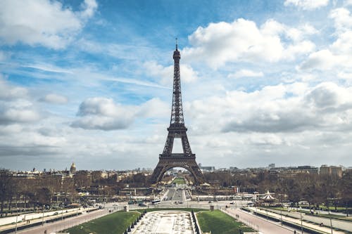 Eiffel Tower Under Blue Sky and White Clouds